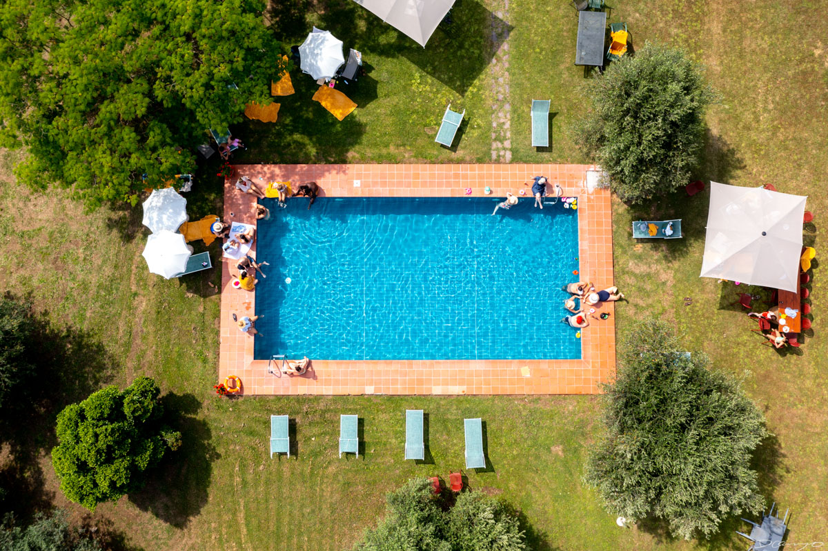 Photos from a trip through Italy in Summer of 2023. Locations include Rome, Florence, Tuscany, Castello di Bossi in Chianti, Siena, San Gimignano, Sirmione on Lake Garda, Bologna, Gudon, Italian Dolomites, Seceda, Cadini di Misurina, and Venice.